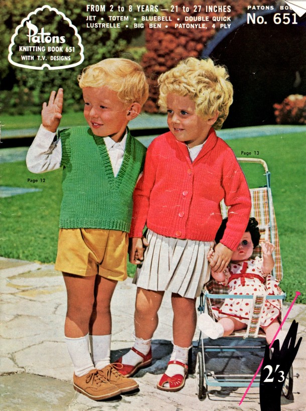 Small boy in knitted vest, small girl in knitted cardigan